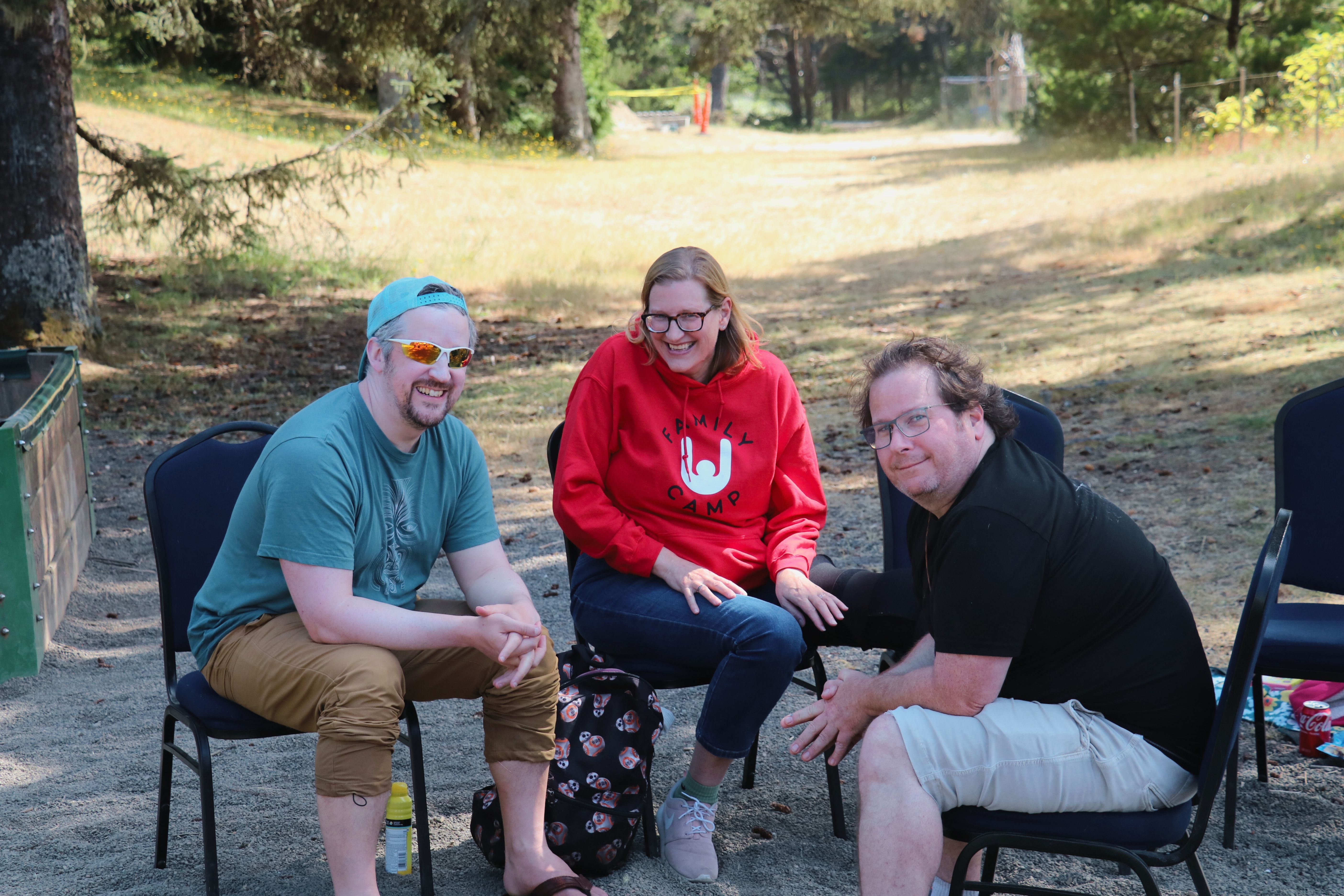 3 parents talking and smiling