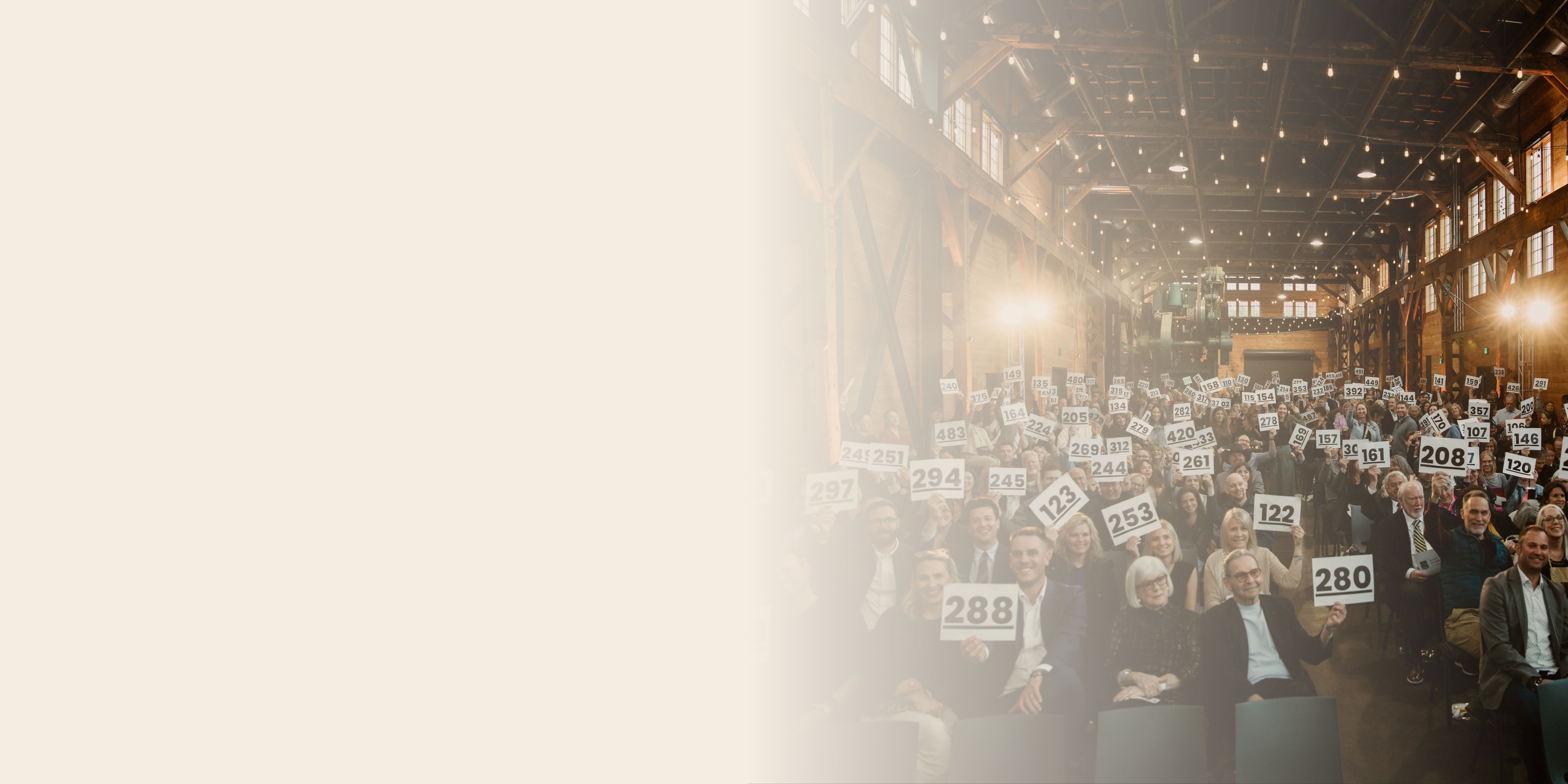 Photo of paddle raise at fundraising event with cream gradient overlay