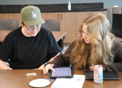 Two participants working on an ipad